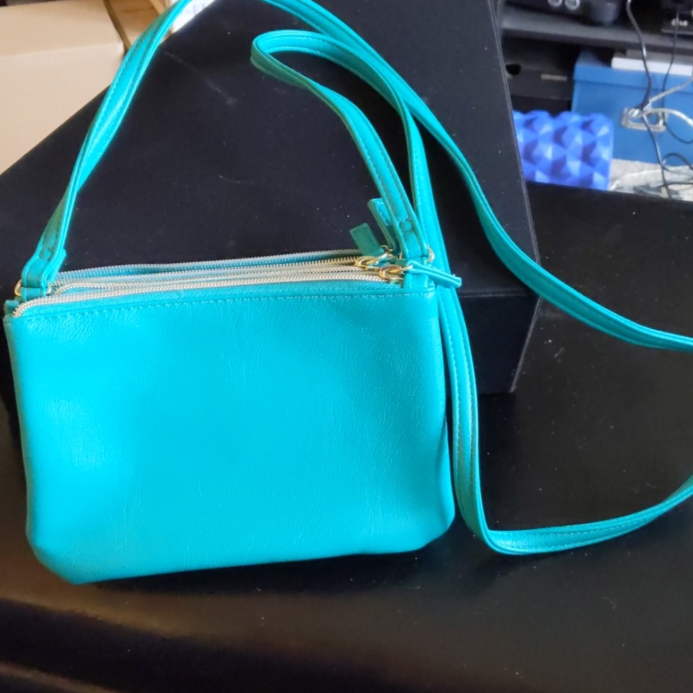 Turquoise triple pocket travel purse.